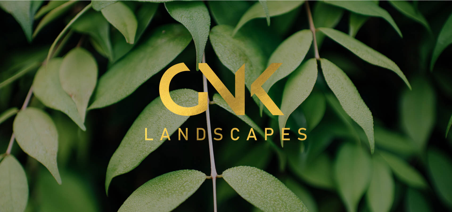 GNK Landscapes logo on foliage